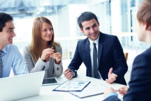 man in meeting with suit and tie